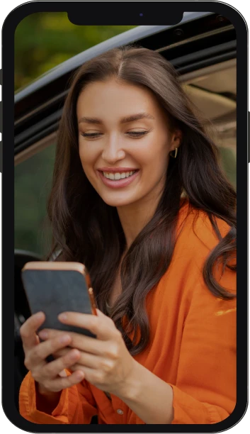 Brunette in orange shirt with phone